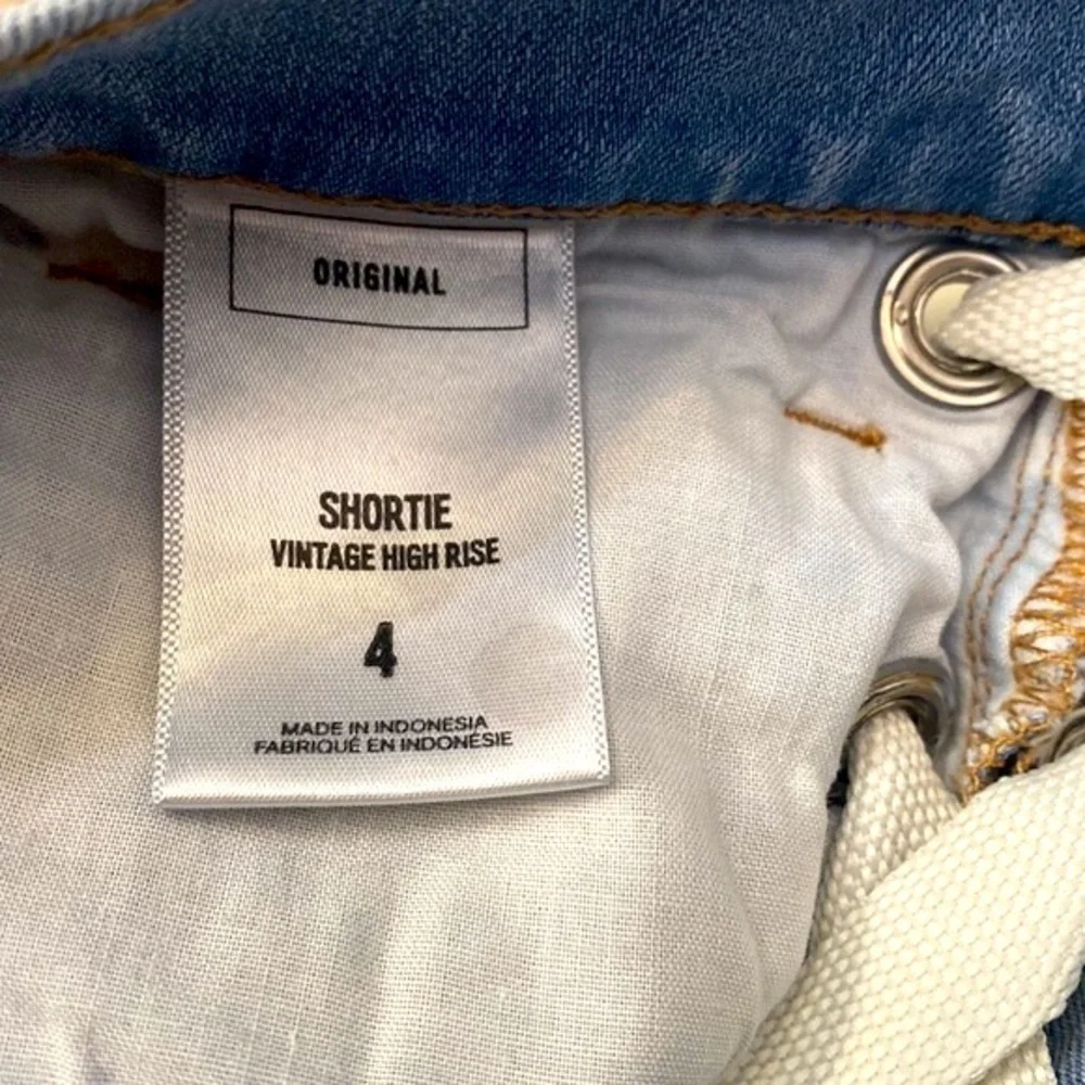 Women’s Express Shortie Vintage High Rise Button-fly Distressed Blue Jean Shorts